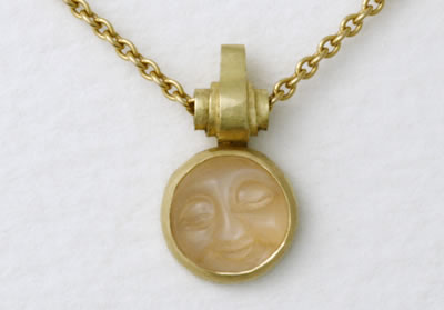 Scroll and Moon face in Indian Moonstone on yellow gold trace chain